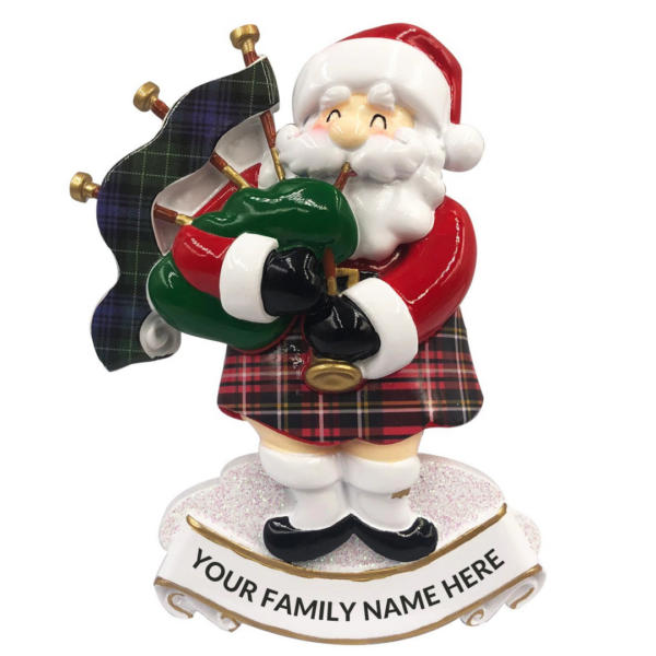 A personalised Christmas tree decoration depicting a Scottish Santa playing the bagpipes. Santa is wearing a red tartan kilt and red jumper and matching Santa hat. His bagpieps are green and have a green tartan over the pipes. Beneath Santa is a white scroll with text tha reads 'YOUR FAMILY NAME HERE'.