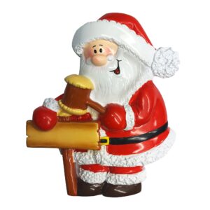 A polyresin Personalisable Christmas tree decoration in the shape of Santa. Santa is hammering a signpost with a mallet. On the signpost there is space for a name to be written.