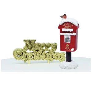 A polyresin red postbox cake decoration. This snowy topped postbox is in the traditional red colour with gold lettering that says 'LETTERS ONLY' above the letterbox. On top, in the snow sits a Christmas Robin. The box is mounted on a black pole which sits in a mound of snow. It is next to a gold plastic Merry Christmas motto cake decoration.