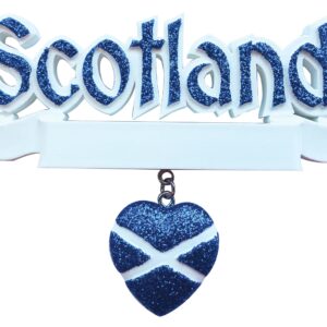 A Personalised Christmas Decoration. The word 'Scotland' in royal blue glitter sits above a white banner where a family name or motto can be written. Beneath the banner hangs a royal blue glitter heart with a white St Andrews cross on it.