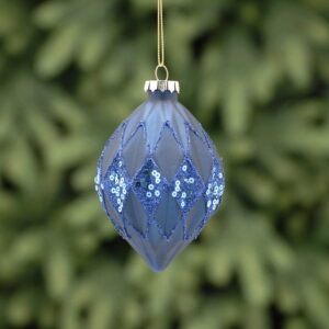 A matt navy, geometric egg shaped, glass Christmas tree bauble decorated with fine lines of blue glitter and blue glitter and sequin diamond shaped panels.