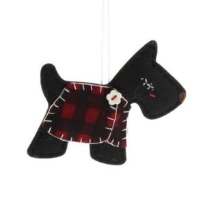 A black felt fabric Christmas tree decoration in the shape of a Scottie dog with a red tartan fabric coat with white sticthing detail finished with a white flower shaped button. The dog has white stitching eyelashed and a brown felt nose.