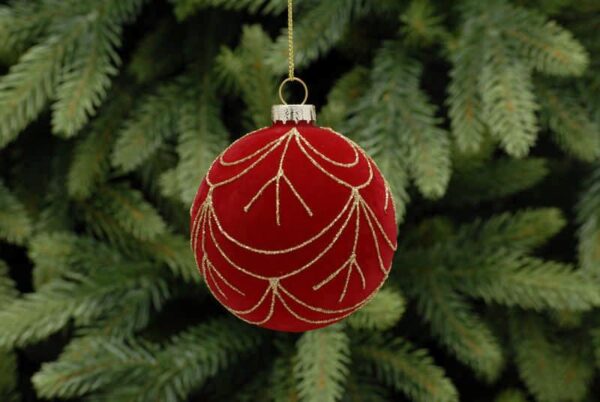 A clear glass Christmas tree bauble covered completly in red flock and decorated with swags of fine gold glitter all the way around.