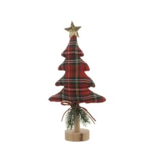 A tall plush, red tartan fabric, Christmas tree shaped ornament with a wooden dowel trunk on a wooden plinth. Decorated with a sprig of festive foliage and a pine cone tired up with ribbon at its base and a gold glitter star on top.