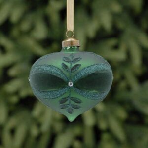 A matt green onion shaped glass Christmas tree bauble decorated with a leaf and bow pattern in dark green flock and green glitter with a white diamante jewel in the centre.