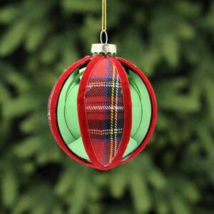 A metallic green, round shaped glass Christmas tree bauble with red tartan fabric segments and finished with red velour ribbon around the segments.