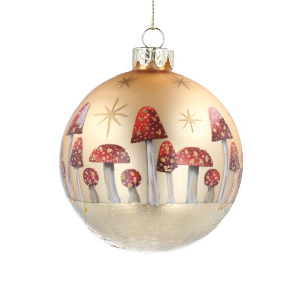 A matt gold Christmas tree bauble deocrated with hand painted red and white toadstools all the way around. The toadstools have gold spots on their caps and gold stars above them. The base of the bauble is covered in gold leaf.