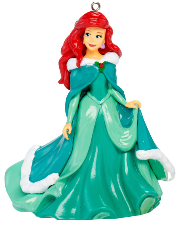 A polyresin Christmas tree decoration depicting Disney's Ariel from the Little Mermaid. She is wearing a long green dress with matching cloak.