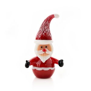 A hand blown glass santa figurine. He has a round red glass body with outstretched arms, Black gloves and a white trim around his belly. He has a jolly pink face with white beard and moustache topped off with a red Santa hat with white trim and pom pom. Shown against a white background.