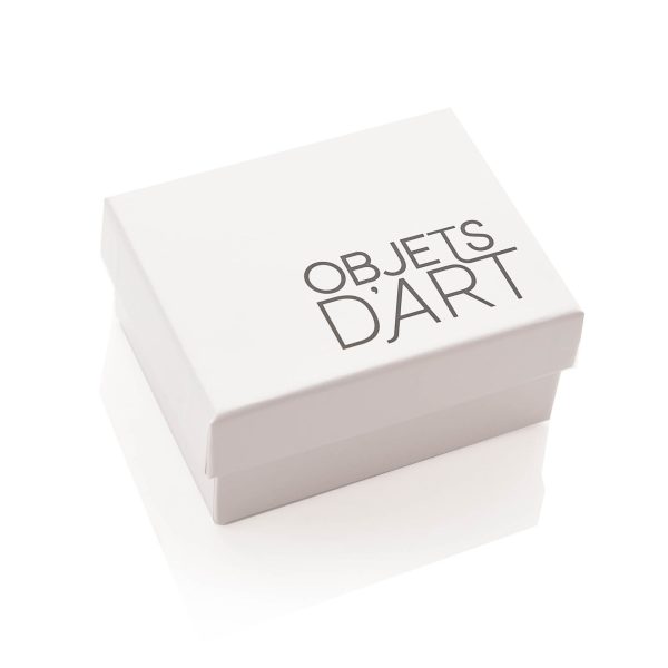 A white box with text in the bottom right hand corner that reads 'Objets d'Art' in dark grey.