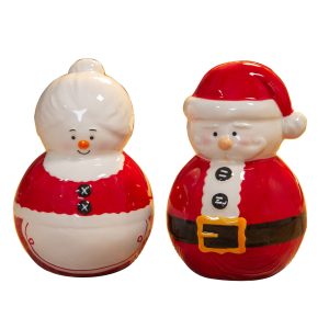 A set of ceramic salt and pepper shakers in the shape of Mr and Mrs Claus. Mrs Claus on the left has a red dress with a white apron and her white hair up in a bun. Santa, on the right, is wearing his red Santa suit with balck belt and gold buckle and his red Santa hat.