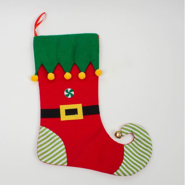 A red and green Elf Christmas Stocking with a bell on it. The main body of the stocking is red with a black belt with gold buckle across the centre and a green and white candy bitton above it. The heel and curly toe are covered in a green and white striped fabric with a gold bell at the tip of the toe. The cuff is green felt with elf points that are finished with yellow pompoms at the tip of each point. It has a red ribbon loop for hanging.