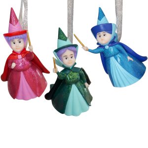 Set of three polyresin hanging Christmas tree decorations depicting Flora (in red), Fauna (in green) and Merryweather (in blue) from Disney's Sleeping Beauty. All have sparkly glitter dresses and matching withcy hats and are holding wands.