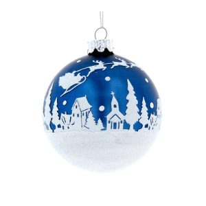 A midnight blue bauble with a fabulous white winter scene adorning the midnight blue setting. The winter scene is made up of a bed of snow along the bottom of the bauble with little houses, churches and trees upon the 'bed' of snow. Santa, his sleigh and the reindeer are climbing through the sky over the roof tops and snow is falling from the sky. The bauble in this photo is set against a white background.