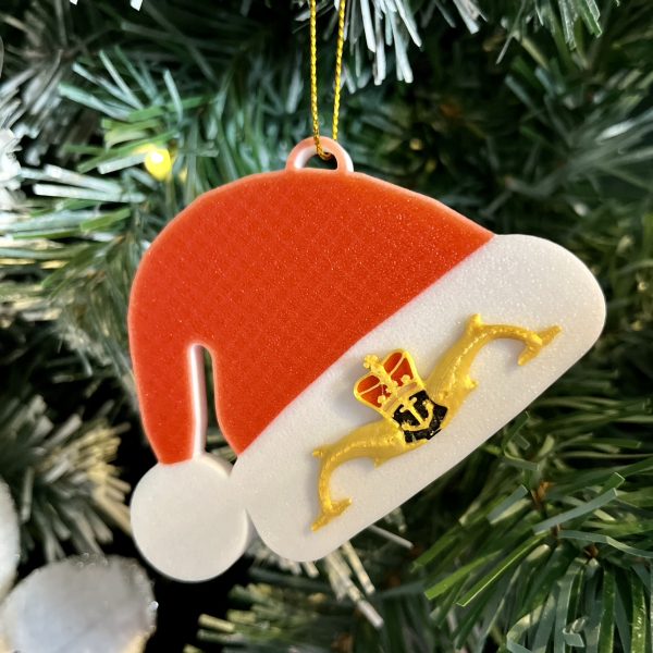 3D Printed Santa Hat with Gold Submariners Dolphins witha gold string for hanging on the tree.