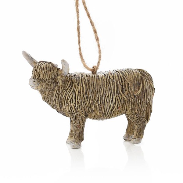 A polyresin Christmas tree decoration in the shape of a Highland Coo complete with horns. It hangs from a hessian string.