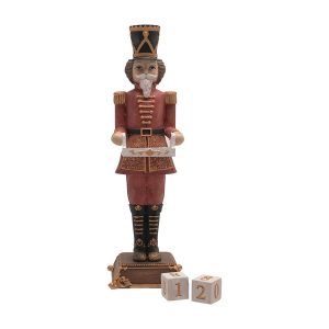 A traditional vintage soldier figurine dressed in a red and gold uniform, standing holding a tray for two number blocks that are used for counting down to Christmas.