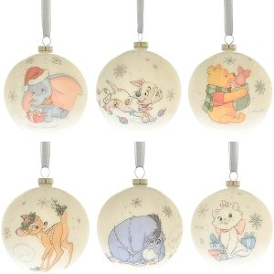 The Set of Six Disney Magical Beginnings Baubles each features a different Disney character, including Dumbo, Patch Winnie the Pooh and Piglet, Bambi, Eeyore, and Marie, all adorned with festive decorations.