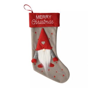 A Christmas stocking with a 3D festive Gonk on the front. Grey felt with red cuff and 'Merry Christmas' text on cuff and 3D plush Gonk with red hat, mittens and shoes and big white fluffy beard on the front.