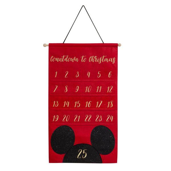 Luxury Embroidered Disney's Mickey Mouse Fabric Advent Calendar with numbered pockets from 1 to 24 and a large black Mickey Mouse head silhouette for the 25th day, hanging from a wooden rod., labeled "countdown to christmas," with pockets numbered 1 to 25 and a large black mickey mouse silhouette at the bottom.