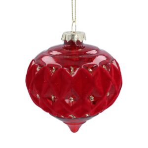 A stunning red glass Christmas ornament with a flocked red diamond pattern and gold accents hangs gracefully by a string.