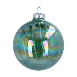 A shiny, green glass Christmas ornament with iridescent reflections and slight ribbing texture on the inside of the bauble hangs by a silver fastener and thread,