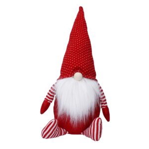 A plush gnome featuring a tall red hat, a white beard, and striped red-and-white limbs is adorned with the Pretty Pale Gold Clip On Magnolia Flower with Sequins for added charm.