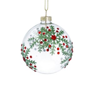 Clear glass ornament with red beads and green leaf designs, hanging from a gold string.