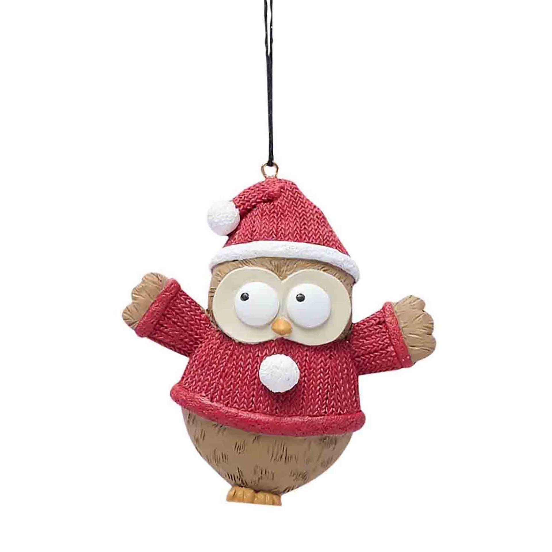 Cute Christmas Owl Hanging Decoration Bring a hooting good time to your Christmas tree this year with this adorable owl decoration. With his fluffy feathers and warm red knitted sweater, this little fellow will add a festive touch of fun to your holiday decor. His large eyes gaze playfully out from under a jaunty Santa hat, ready to spread Christmas cheer. Crafted from durable polyresin, this detailed 5 inch ornament features hand-painted accents and a red cord for hanging. A delightful gift for the owl lover in your life, this merry little bird is sure to be a tree topper! Place him on your branches and let his whimsical charm bring joy to your celebrations.